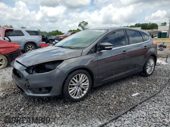 2015 Ford Focus Titanium z VIN 1FADP3N28FL239706, wystawiony jako Copart lot #62478895 z przebiegiem 143 536 mil mil oraz Szkoda całkowita • Salvage title. Historia ofert i sprzedaży dostępna na DreamBid. Obrazek 1.