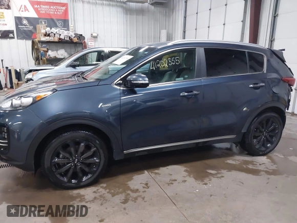 2019 Kia Sportage EX z VIN KNDPNCAC0K7575087, wystawiony jako IAAI lot #41202355 z przebiegiem 31 768 mil mil oraz . Historia ofert i sprzedaży dostępna na DreamBid. Obrazek 14.