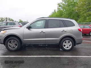 2011 Hyundai Santa Fe GLS z VIN 5XYZGDAB1BG027604, wystawiony jako IAAI lot #42219358 z przebiegiem 145 948 mil mil oraz . Historia ofert i sprzedaży dostępna na DreamBid. Obrazek 14.