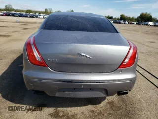 2011 Jaguar XJ with VIN SAJXA2GE5BMV13122, listed as a Copart auction lot 73113044 with 164,196 mi miles and Salvage Title. Bid and sale history available at DreamBid. Image 6.