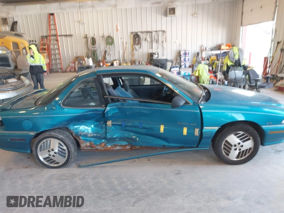 1994 Pontiac Grand Am z VIN 1G2NE15M5RM500643, wystawiony jako IAAI lot #42069901 z przebiegiem 77 129 mil mil oraz . Historia ofert i sprzedaży dostępna na DreamBid. Obrazek 6.