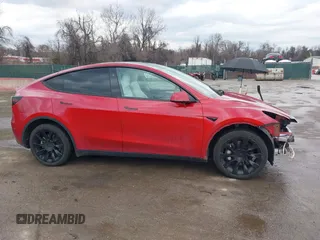 2023 Tesla Model Y Long Range with VIN 7SAYGDEE1PA169031, listed as a IAAI auction lot 41660766 with 35,253 mi miles and . Bid and sale history available at DreamBid. Image 14.
