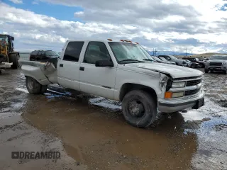 1999 Chevrolet Silverado 3500 z VIN 1GCHC33J2XF087634, wystawiony jako Copart lot #58106714 z przebiegiem 205 431 mil mil oraz Czysty tytuł • Clean title. Historia ofert i sprzedaży dostępna na DreamBid. Obrazek 4.