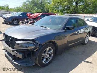 2023 Dodge Charger SXT with VIN 2C3CDXBG4PH515632, listed as a IAAI auction lot 42000682 with 56,163 mi miles. Bid and sale history available at carsss.com. Image 2.