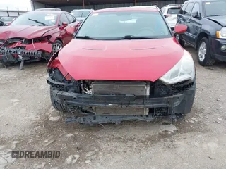 2013 Hyundai Veloster w/Gray Int z VIN KMHTC6AD8DU146035, wystawiony jako IAAI lot #41892703 z przebiegiem 241 169 mil mil oraz . Historia ofert i sprzedaży dostępna na DreamBid. Obrazek 6.