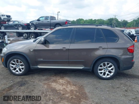 2012 BMW X5 35i with VIN 5UXZV4C59CL766849, listed as a IAAI auction lot 42749836 with 179,273 mi miles and . Bid and sale history available at DreamBid. Image 14.