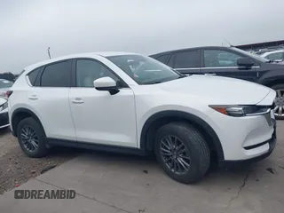 2017 Mazda CX-5 Touring z VIN JM3KFBCL5H0128584, wystawiony jako IAAI lot #42354669 z przebiegiem 56 563 mil mil oraz . Historia ofert i sprzedaży dostępna na DreamBid. Obrazek 13.