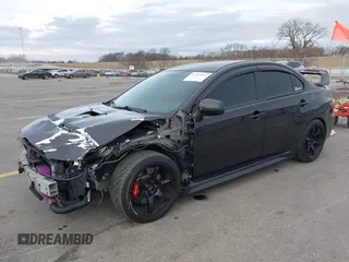 2013 Mitsubishi Lancer Evolution GSR with VIN JA32W8FV8DU012080, listed as a IAAI auction lot 41379744 with 95,070 mi miles. Bid and sale history available at carsss.com. Image 2.