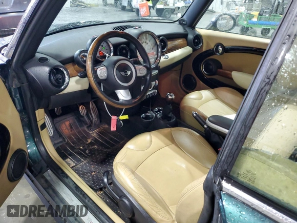 2010 MINI Convertible S with VIN WMWMS3C54ATY51980, listed as a Copart auction lot 56589265 with 147,136 mi miles and Salvage title. Bid and sale history available at DreamBid. Image 8.