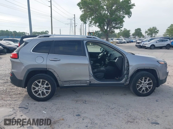 2014 Jeep Cherokee Altitude with VIN 1C4PJMCB4EW107556, listed as a IAAI auction lot 41881448 with 212,816 mi miles and . Bid and sale history available at DreamBid. Image 14.