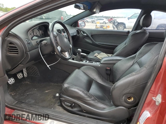 2006 Pontiac GTO z VIN 6G2VX12U66L564449, wystawiony jako Copart lot #71022094 z przebiegiem 179 964 mil mil oraz Szkody całkowita. Historia ofert i sprzedaży dostępna na DreamBid. Obrazek 7.
