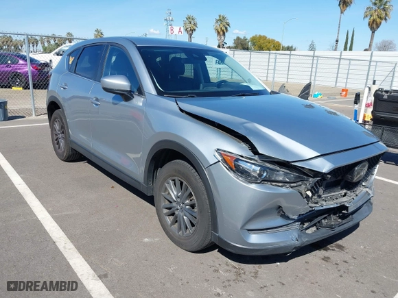 2020 Mazda CX-5 Touring with VIN JM3KFACM7L0774401, listed as a IAAI auction lot 41803453 with NaN miles. Bid and sale history available at carsss.com. Image 1.