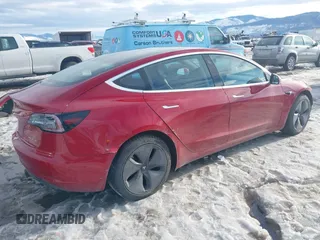 2018 Tesla Model 3 Long Range Battery with VIN 5YJ3E1EB0JF064041, listed as a IAAI auction lot 41562239 with 54,720 mi miles and . Bid and sale history available at DreamBid. Image 4.