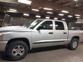 2005 Dodge Dakota SLT with VIN 1D7HW48N15S164352, listed as a IAAI auction lot 42190403 with 150,794 mi miles and . Bid and sale history available at carsss.com. Image 14.