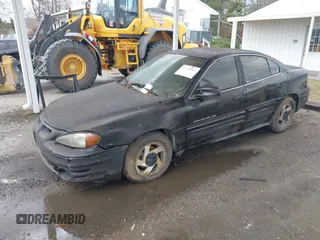 1999 Pontiac Grand Am SE1 with VIN 1G2NE52E5XC575530, listed as a IAAI auction lot 41725461 with 192,009 mi miles. Bid and sale history available at carsss.com. Image 2.