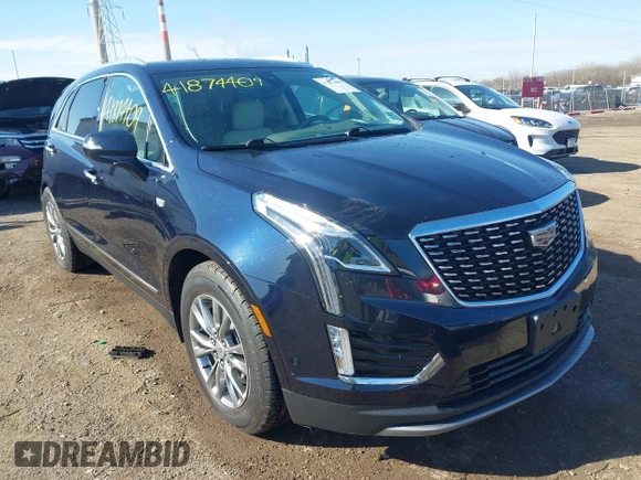 2021 Cadillac XT5 FWD Premium Luxury z VIN 1GYKNCRS2MZ141440, wystawiony jako IAAI lot #41874409 z przebiegiem 76 911 mil mil oraz . Historia ofert i sprzedaży dostępna na DreamBid. Obrazek 1.