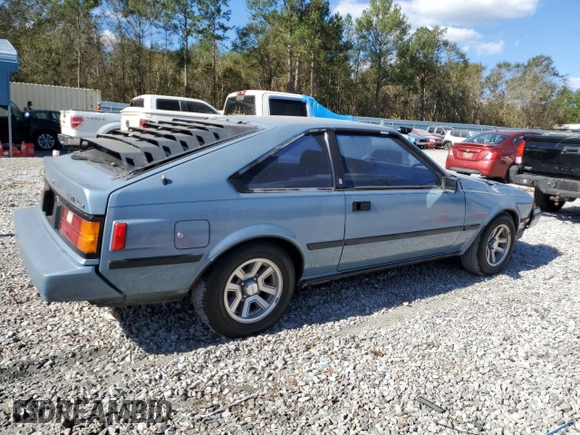 1983 Toyota Celica z VIN JT2RA64L7D6174381, wystawiony jako Copart lot #75986554 z przebiegiem 312 583 mil mil oraz Szkoda całkowita • Salvage title. Historia ofert i sprzedaży dostępna na DreamBid. Obrazek 3.