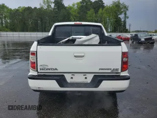 2010 Honda Ridgeline RTL z VIN 5FPYK1F53AB006195, wystawiony jako Copart lot #52528435 z przebiegiem 205 522 mil mil oraz Szkoda całkowita • Salvage title. Historia ofert i sprzedaży dostępna na DreamBid. Obrazek 6.