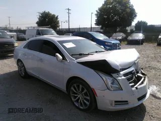 2016 Cadillac XTS Luxury Collection with VIN 2G61M5S35G9121509, listed as a IAAI auction lot 40099300 with Not provided miles and . Bid and sale history available at DreamBid. Image 1.