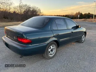 1993 Geo Prizm z VIN 1Y1SK5365PZ054069, wystawiony jako Copart lot #84108844 z przebiegiem 82 611 mil mil oraz Tytuł czysty. Historia ofert i sprzedaży dostępna na DreamBid. Obrazek 4.