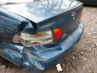 2000 Chevrolet Prizm LSi z VIN 1Y1SK5289YZ401584, wystawiony jako IAAI lot #42263210 z przebiegiem 151 567 mil mil oraz . Historia ofert i sprzedaży dostępna na DreamBid. Obrazek 6.