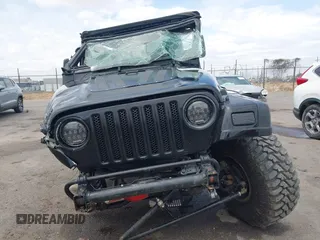 2004 Jeep Wrangler Rubicon z VIN 1J4FA69S84P727716, wystawiony jako IAAI lot #42162129 z przebiegiem 90 844 mil mil oraz . Historia ofert i sprzedaży dostępna na DreamBid. Obrazek 13.
