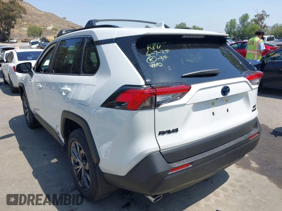 2024 Toyota RAV4 Hybrid XLE Premium with VIN JTMB6RFV9RJ063328, listed as a IAAI auction lot 42433233 with 9,874 mi miles and . Bid and sale history available at DreamBid. Image 3.
