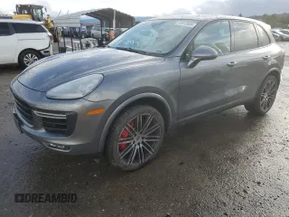 2016 Porsche Cayenne Turbo z VIN WP1AC2A23GLA89044, wystawiony jako Copart lot #41512034 z przebiegiem 27 937 mil mil oraz . Historia ofert i sprzedaży dostępna na DreamBid. Obrazek 1.