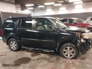 2011 Honda Pilot Touring with VIN 5FNYF4H97BB099528, listed as a IAAI auction lot 41721800 with 132,979 mi miles. Bid and sale history available at carsss.com. Image 13.