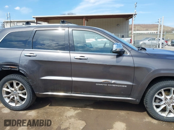 2014 Jeep Grand Cherokee Summit with VIN 1C4RJFJM5EC377129, listed as a IAAI auction lot 41763932 with 187,561 mi miles and . Bid and sale history available at DreamBid. Image 13.