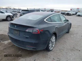 2018 Tesla Model 3 Long Range Battery with VIN 5YJ3E1EB9JF188437, listed as a IAAI auction lot 41371254 with 55,934 mi miles and . Bid and sale history available at DreamBid. Image 4.