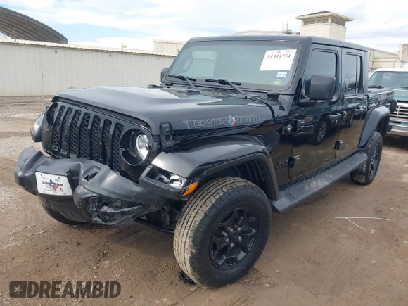 2021 Jeep Gladiator Freedom z VIN 1C6HJTAG4ML586999, wystawiony jako IAAI lot #41911751 z przebiegiem 81 030 mil mil oraz . Historia ofert i sprzedaży dostępna na DreamBid. Obrazek 2.