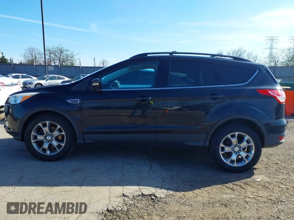 2013 Ford Escape SEL with VIN 1FMCU9HX1DUA20307, listed as a IAAI auction lot 41933873 with 164,962 mi miles. Bid and sale history available at carsss.com. Image 13.