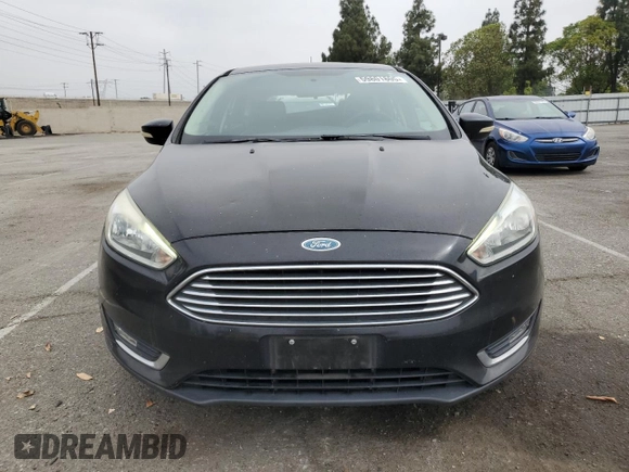 2015 Ford Focus Titanium z VIN 1FADP3N25FL324390, wystawiony jako Copart lot #59801805 z przebiegiem 97 615 mil mil oraz Szkoda całkowita • Salvage title. Historia ofert i sprzedaży dostępna na DreamBid. Obrazek 5.