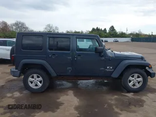 2007 Jeep Wrangler Unlimited X with VIN 1J4GA39137L101321, listed as a IAAI auction lot 42095445 with 243,583 mi miles and . Bid and sale history available at DreamBid. Image 13.