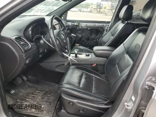 2015 Jeep Grand Cherokee High Altitude with VIN 1C4RJFCG2FC196563, listed as a Copart auction lot 56302315 with 143,759 mi miles and Salvage title. Bid and sale history available at DreamBid. Image 7.