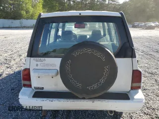 1997 Geo Tracker LSi z VIN 2CNBE1360V6927915, wystawiony jako Copart lot #53469605 z przebiegiem 119 413 mil mil oraz Szkody całkowita. Historia ofert i sprzedaży dostępna na DreamBid. Obrazek 6.