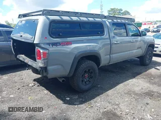 2021 Toyota Tacoma SR5 with VIN 3TMDZ5BN3MM112338, listed as a IAAI auction lot 42241704 with 81,346 mi miles and . Bid and sale history available at DreamBid. Image 4.