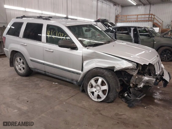 2009 Jeep Grand Cherokee Laredo with VIN 1J8GR48KX9C516873, listed as a IAAI auction lot 41610781 with 199,246 mi miles. Bid and sale history available at carsss.com. Image 1.