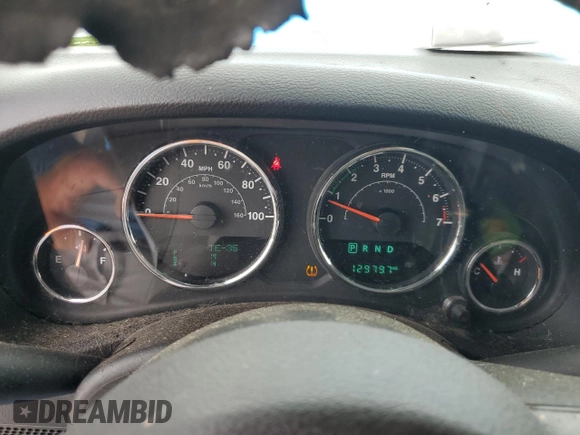 2015 Jeep Wrangler Unlimited Willys Wheeler with VIN 1C4BJWDG4FL611656, listed as a Copart auction lot 54010395 with 129,797 mi miles and Salvage Title. Bid and sale history available at DreamBid. Image 9.
