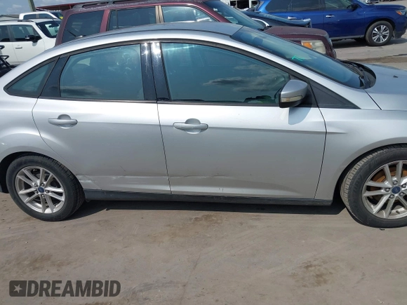 2015 Ford Focus SE z VIN 1FADP3F21FL348863, wystawiony jako IAAI lot #42401820 z przebiegiem 126 329 mil mil oraz . Historia ofert i sprzedaży dostępna na DreamBid. Obrazek 13.