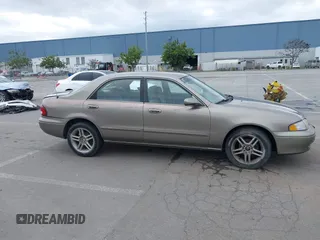 1999 Mazda 626 ES with VIN 1YVGF22C8X5900510, listed as a IAAI auction lot 41479213 with 178,182 mi miles. Bid and sale history available at carsss.com. Image 13.