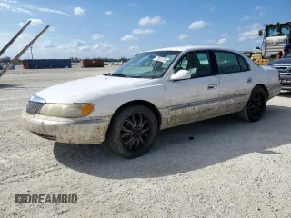 1998 Lincoln Continental with VIN 1LNFM97V5WY637895, listed as a Copart auction lot 77020154 with 0 mi miles and Salvage Title. Bid and sale history available at carsss.com. Image 1.