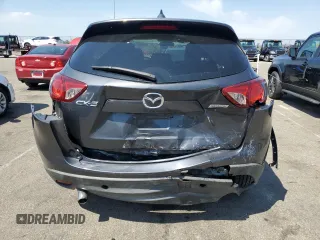 2016 Mazda CX-5 Touring with VIN JM3KE2CY2G0612029, listed as a Copart auction lot 53810155 with 159,915 mi miles and Salvage Title. Bid and sale history available at DreamBid. Image 6.
