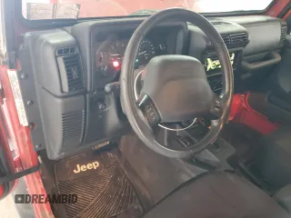 2000 Jeep Wrangler Sport with VIN 1J4FA49S9YP751596, listed as a Copart auction lot 52527315 with 132,514 mi miles and Clean Title. Bid and sale history available at carsss.com. Image 8.
