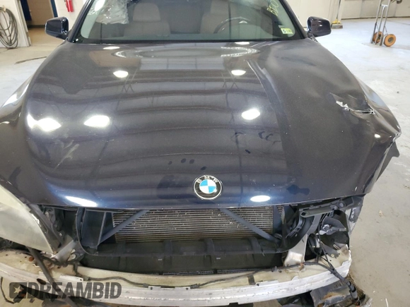 2011 BMW 7 Series 740i with VIN WBAKA4C53BC392488, listed as a Copart auction lot 77876674 with 0 mi miles and Salvage Title. Bid and sale history available at carsss.com. Image 12.