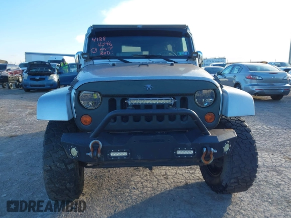 2010 Jeep Wrangler Unlimited Sahara with VIN 1J4BA5H14AL230604, listed as a IAAI auction lot 41884346 with 97,060 mi miles. Bid and sale history available at carsss.com. Image 12.