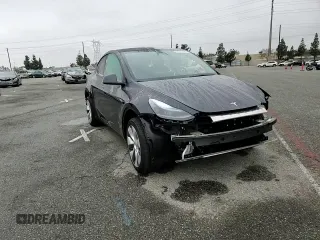 2024 Tesla Model Y with VIN 7SAYGDED5RF093410, listed as a Copart auction lot 50557225 with 6,396 mi miles and Salvage Title. Bid and sale history available at DreamBid. Image 11.