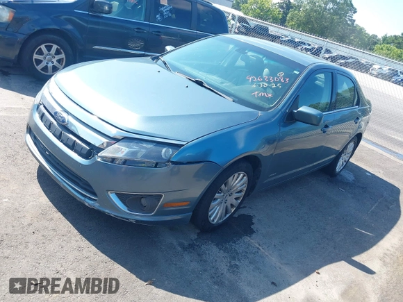 2011 Ford Fusion Hybrid with VIN 3FADP0L3XBR217504, listed as a IAAI auction lot 42633083 with 166,274 mi miles and . Bid and sale history available at DreamBid. Image 2.