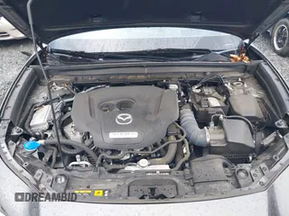 2021 Mazda CX-30 Premium with VIN 3MVDMBDY2MM239231, listed as a IAAI auction lot 41655159 with 22,679 mi miles and . Bid and sale history available at carsss.com. Image 10.